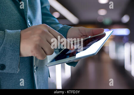 man touch tablet, laptop connecting wifi technology business people workspace Stock Photo