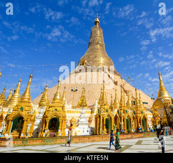 YANGON, MYANMAR - JAN 14, 2015. Burmese people visit at Shwedagon Pagoda in Yangon, Myanmar. Shwedagon Pagoda is the most sacred Buddhist pagoda for t Stock Photo