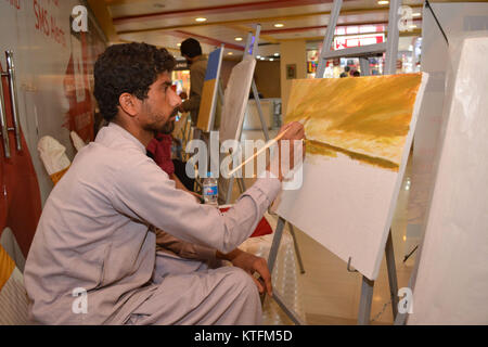 QUETTA, PAKISTAN. Dec-24 2017:  Artists from different academies and art centrers drawing the painting during Fine Arts competition Drought Resilient Agriculture Modelling at millennium mall in Quetta Pakistan. Organized by Islamic Relief Stock Photo