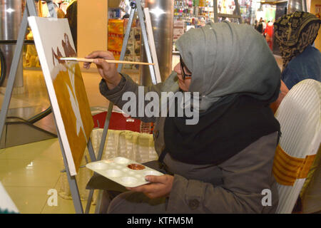 QUETTA, PAKISTAN. Dec-24 2017:  Artists from different academies and art centrers drawing the painting during Fine Arts competition Drought Resilient Agriculture Modelling at millennium mall in Quetta Pakistan. Organized by Islamic Relief Stock Photo