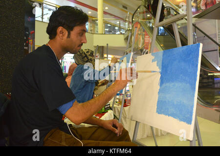 QUETTA, PAKISTAN. Dec-24 2017: Artists from different academies and art centrers drawing the painting during Fine Arts competition Drought Resilient Agriculture Modelling at millennium mall in Quetta Pakistan. Organized by Islamic Relief Stock Photo