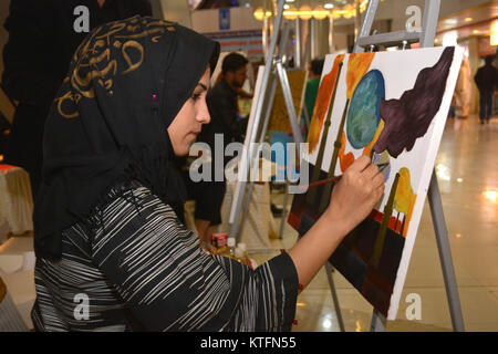 QUETTA, PAKISTAN. Dec-24 2017: Artist from different academies and art centrers drawing the painting during Fine Arts competition Drought Resilient Agriculture Modelling at millennium mall in Quetta Pakistan. Organized by Islamic Relief Stock Photo