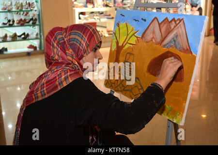 QUETTA, PAKISTAN. Dec-24 2017: Artist from different academies and art centrers drawing the painting during Fine Arts competition Drought Resilient Agriculture Modelling at millennium mall in Quetta Pakistan. Organized by Islamic Relief Stock Photo