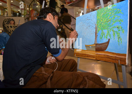 QUETTA, PAKISTAN. Dec-24 2017: Artist from different academies and art centrers drawing the painting during Fine Arts competition Drought Resilient Agriculture Modelling at millennium mall in Quetta Pakistan. Organized by Islamic Relief Stock Photo