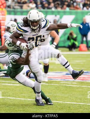 East Rutherford, New Jersey, USA. 24th Dec, 2017. Los Angeles Chargers running back MELVIN GORDON (28) runs with the ball as New York Jets safety MARCUS MAYE (26) tries to bring him down during NFL action at MetLife Stadium. Credit: csm/Alamy Live News Stock Photo