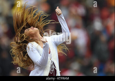 Landover, MD, USA. 24th Dec, 2017. A Washington Redskin cheerleader  performs in a santa outfit during the season ending home matchup between  the Denver Broncos and the Washington Redskins at FedEx Field