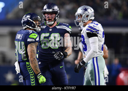 Seattle Seahawks running back Thomas Rawls (34) hurdles Carolina Panthers  cornerback Daryl Worley (26) on his way to a 8-yard touchdown in the first  quarter at CenturyLink Field in Seattle, Washington on