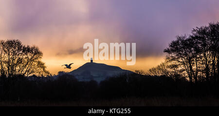 Glastonbury, Somerset, UK. 26th Dec 2017. UK Weather: Boxing day sunrise over Glastonbury Tor. Credit: Guy Corbishley/Alamy Live News Stock Photo