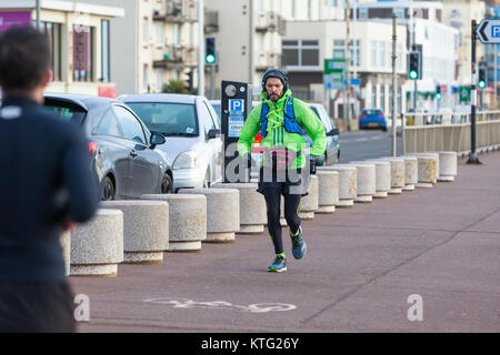 Hastings, East Sussex, UK. 26th December 2017. Lots of people out and about enjoying the mild boxing day weather this morning. This man takes jogging to another level. Photo Credit: Paul Lawrenson/ Alamy Live News Stock Photo