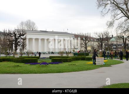 People at the exterior of the neoclassical Theseus Temple at the center of the public park Volksgarten (Garden of the people) in Vienna, Austria. Stock Photo