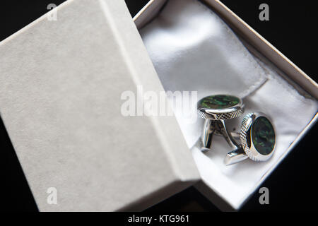 Elegant wedding cufflinks for a classic suit in the box. Stock Photo