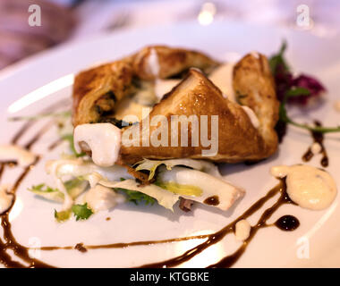 spinach cake on green salad, presented with gourmet style Stock Photo