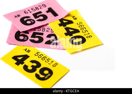 strip of pink raffle tickets on white background Stock Photo: 52647626