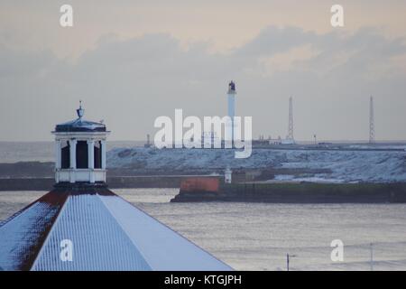 Snow Covered Roof of the Beach Ballroom, Aberdeen Harbour and Girdle Ness Lighthouse in Background. Scotland, UK. December 2017. Stock Photo