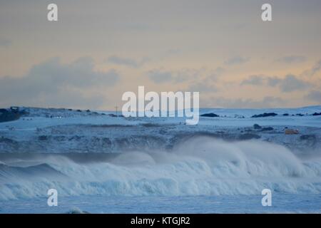 Winter Storm Hits Land at Aberdeen Harbour. Powerful Waves and Girdle Ness Lighthouse in the Background. Scotland, UK.  December 2017. Stock Photo