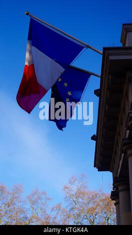 Embassy of France, Tricolour and Flag of Europe. Albert Gate, Hyde Park. London, UK. December 2017. Stock Photo