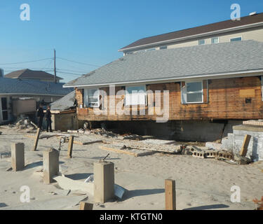 This image depicts the aftermath of a storm, showing significant damage ...