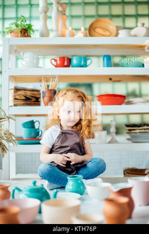 girls in the studio are made of ceramic cups Stock Photo