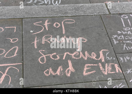 Anti-Trump and anti-racism messages were written on the pavement by children protesting against racism on UN International Anti-Racism Day in London, UK. Stock Photo