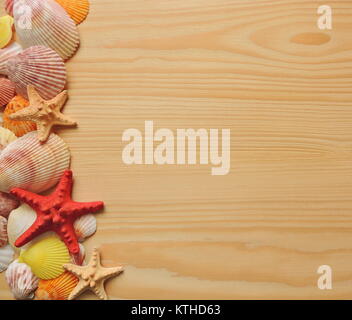 Starfish and seashells on wooden background with copy space for text. Stock Photo