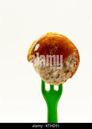 isolated; fork; ketchup; meat; sausage; food; sauce; curry; currywurst; bude; eat; cut; fast; greasy; german; bratwurst; spice; shop; specialty; unhea Stock Photo