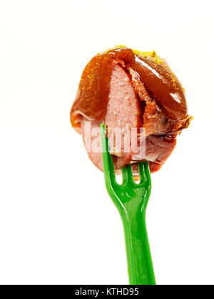 isolated; fork; ketchup; meat; sausage; food; sauce; curry; currywurst; bude; eat; cut; fast; greasy; german; bratwurst; spice; shop; specialty; unhea Stock Photo