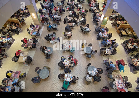 A view of the crowded Food Court at the Queens Center shopping mall in Elmhurst, Queens, New York City. Stock Photo