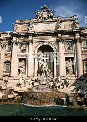 Detail of Trevi fountain, with the statue of Oceanus, two Tritons leading the horses that pulled his chariot and the papal coat of arms on the top. Stock Photo