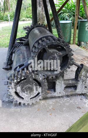 Old roller mill used to crush sugar cane, Dunlawton Sugar Mill Gardens, Port Orange, Florida Stock Photo