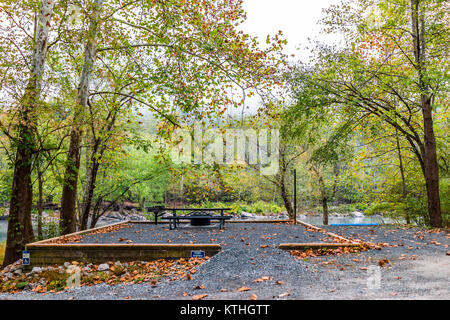 Empty permit required campground site for disabled people with car spot and river, picnic table, fire pit in Grandview Sandbar West Virginia Stock Photo