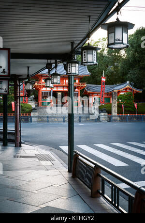 Yasaka shrine,Yasaka-jinja main gate view in morning sunrise from a sidewalk on Shijo dori street in Kyoto in Gion, Kyoto, Japan 2017 Stock Photo