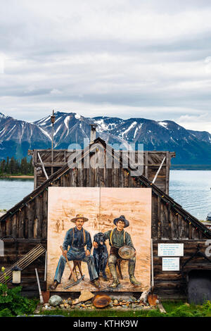 A mural of two gold miners in the small, remote village of Atlin in northern British Columbia, Canada Stock Photo