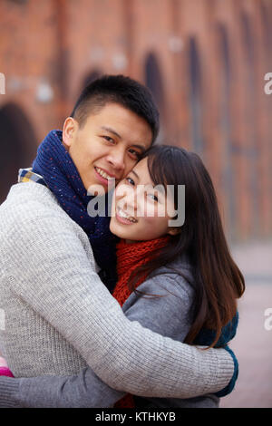 young Chinese man and woman holding together Stock Photo