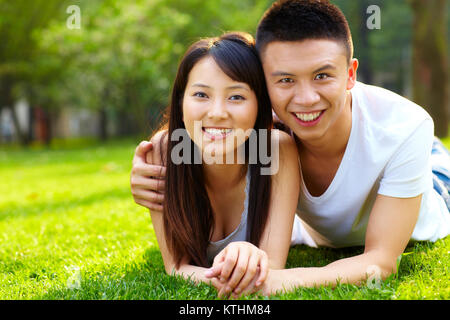 Happy young asian couple outdoor in the park Stock Photo