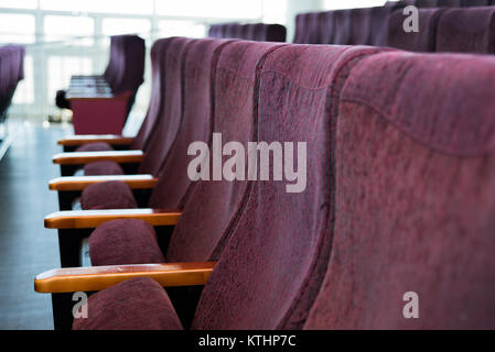 Red seats at the theater. Theater, cinema or circus. Defocused. Stock Photo