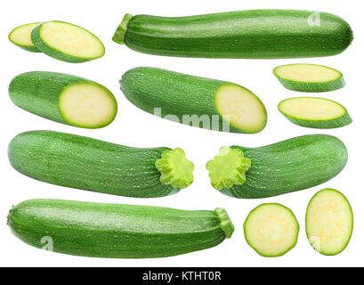 Isolated zucchini. Collection of whole and cut zucchini fruits isolated on white background with clipping path Stock Photo