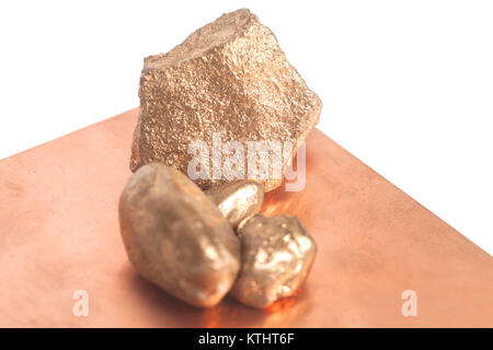 Golden nuggets on a copper background Stock Photo
