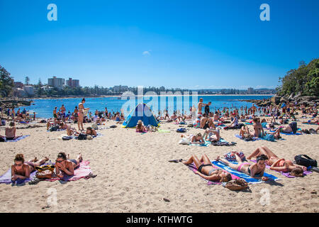 SYDNEY, AUSTRALIA-DEC 21, 2014 :People relaxing on sandy Shelly beach at Manly in Sydney, Australia on Dec 21. 2014.Manly beach is one of a famous bea Stock Photo