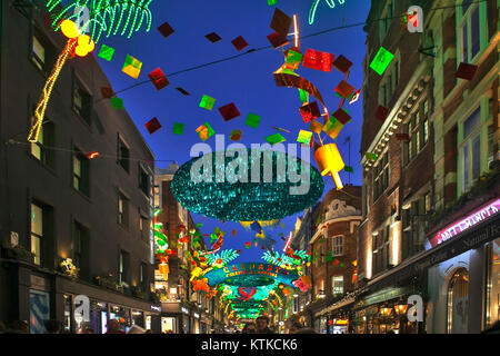 LONDON - DECEMBER 18, 2017: Christmas lights on Carnaby Street, London UK. Carnaby Christmas lights feature some of the most unusual decorations and l Stock Photo