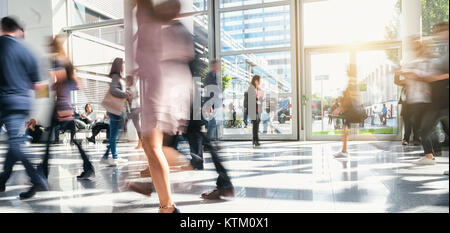 blurred business people rushing in a office center Stock Photo