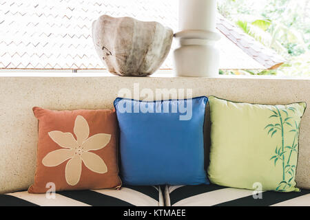 Set of multicolor pillows with flower ornament Stock Photo