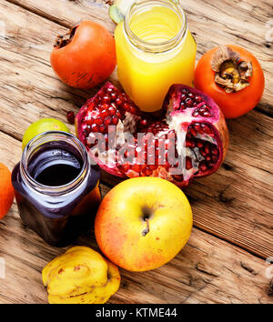 Summer soft juice from fresh fruit. Drink from apples, pomegranate, persimmons and kiwi Stock Photo