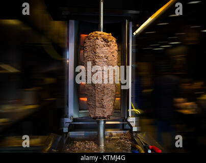 traditional turkish food doner kebab in a street food shop on blur background Stock Photo