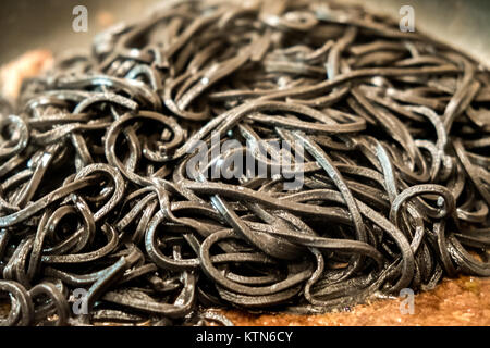 black pasta squid ink closeup italian taglierini al nero di seppia Stock Photo
