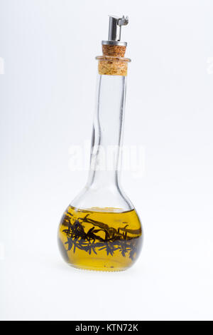 Thyme infused olive oil over white background Stock Photo