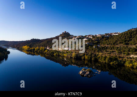 Aerial view of the Belver Castle (Castelo de Belver) and village from the middle of the Tagus River in Portugal; Concept for travel in Portugal Stock Photo