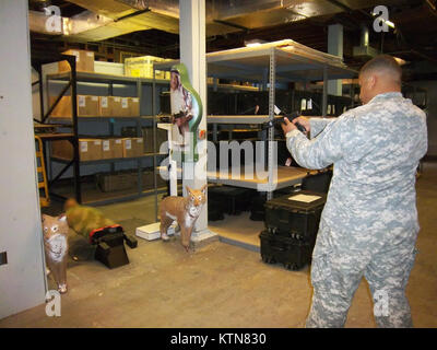 CAMP SMITH TRAINING SITE-- A Camp Smith Soldier demonstrates the LMTS (Laser Marksmanship Training System) which allows Soldiers to  build marksmanship skills and weapons familiarity using a Class IIIA laser. The equipment is availalbe to units training at Camp Smith, the New York National Guard training facility near Peekskill. Stock Photo