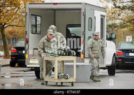 NY Air National Guardsmen of the 105th Airlift Wing processing through the Personnel Deployment Function managed by members of the 105th Force Support Squadron, Monday Oct. 29, 2012. NY Air  Guardsmen await orders to deploy in support of Hurricane Sandy relief efforts.  The airmen are among more than 1,100 Army and Air National Guard Soldiers and Airmen deployed at the order of New York Governor Andrew M. Cuomo to respond to the storm. (National Guard photo by Tech. Sgt. Michael OHalloran)(Released) Stock Photo