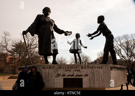 WASHINGTON, D.C. — – People pause on Monday January, 21st in front The Mary McLeod Bethune Memorial. The bronze statue of Mary McLeod Bethune, by Robert Berkslocated in Lincoln Park, is located at East Capitol Street and 12th Street N.E. Washington, D.C.. Mary Jane McLeod Bethune (July 10, 1875 – May 18, 1955) was an American educator and civil rights leader best known for starting a school for African-American students in Daytona Beach, Florida, that eventually became Bethune-Cookman University and for being an advisor to President Franklin D. Roosevelt.  The 57th Presidential Inauguration wa Stock Photo