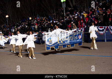 WASHINGTON, D.C. — – President Barack Obama watches the Ballou Senior High School “Majestic” Marching Knights pass in front of the Presidential Inauguration Parade official review stand. The 57th Presidential Inauguration was held in Washington D.C. on Monday, January 21, 2013.The procession of more than 8,000 people that started at Constitution Avenue continued down Pennsylvania Avenue to the White House included ceremonial military regiments, citizen groups, marching bands and floats. The President, Vice President, their spouses and special guests then review the parade as it passes in front Stock Photo